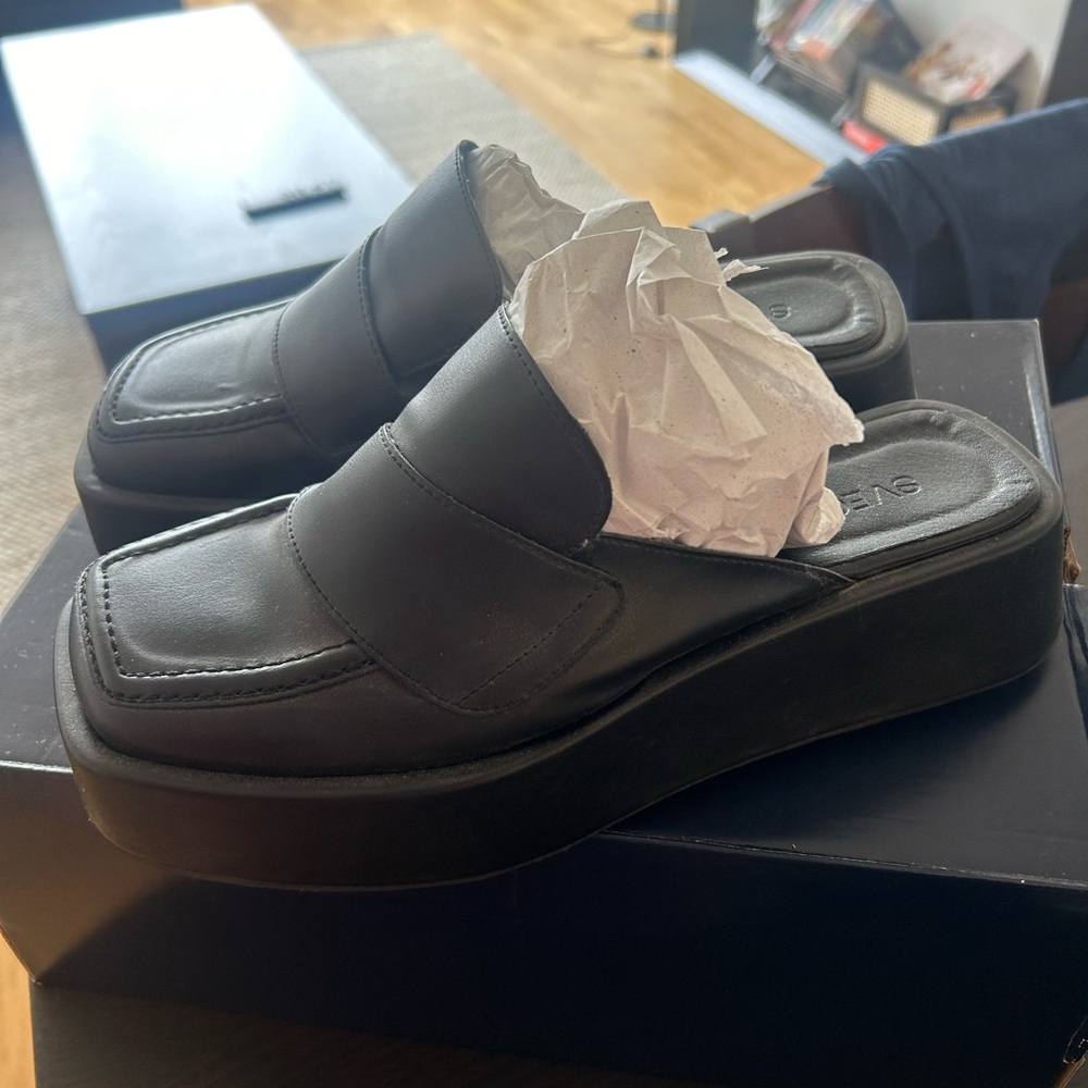 Black platform slip on loafers / mules
